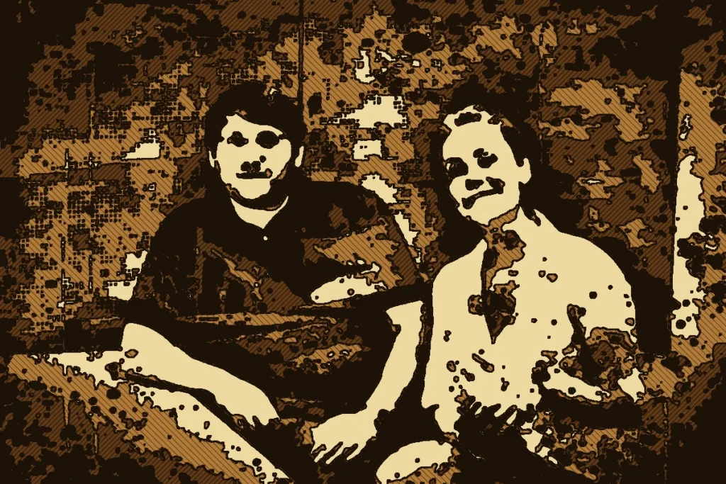 Ein Mann mit dunklem Hemd und eine Frau in hellem Hemd sitzen nebeneinander. Das ganze Bild ist ein Holzschnitt-Druck in vier Brauntönen mit dicken Konturen und feiner Schraffur.